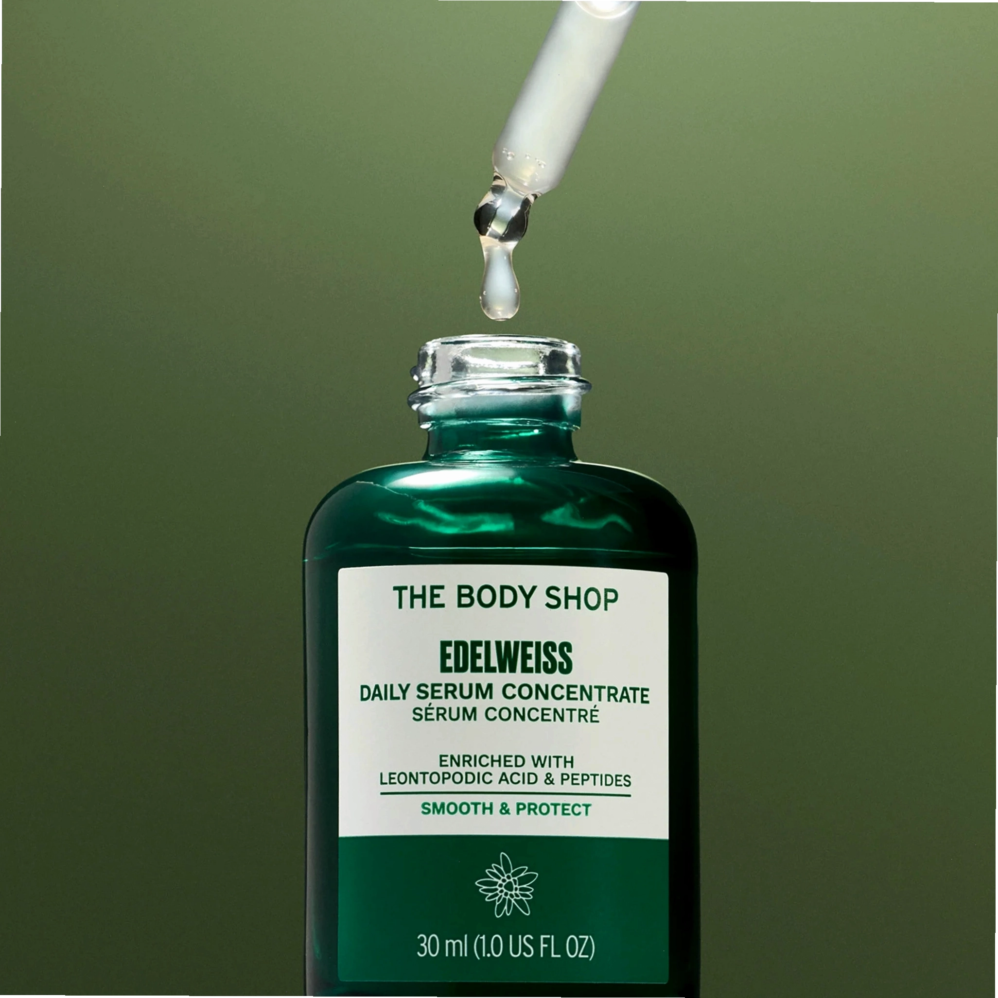 Edelweiss Serum with dropper on green background