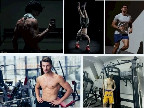 Nam giới tạo dáng đứng trong phòng gym, khoe cơ bụng và tay săn chắc