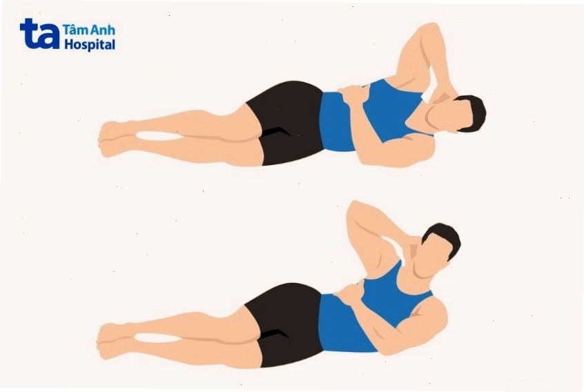 Người phụ nữ thực hiện bài tập gập bụng nghiêng side crunch