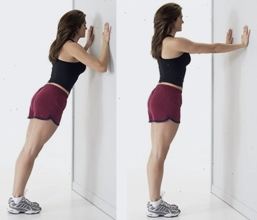 Phụ nữ thực hiện bài tập squat tăng cơ giảm mỡ tại nhà